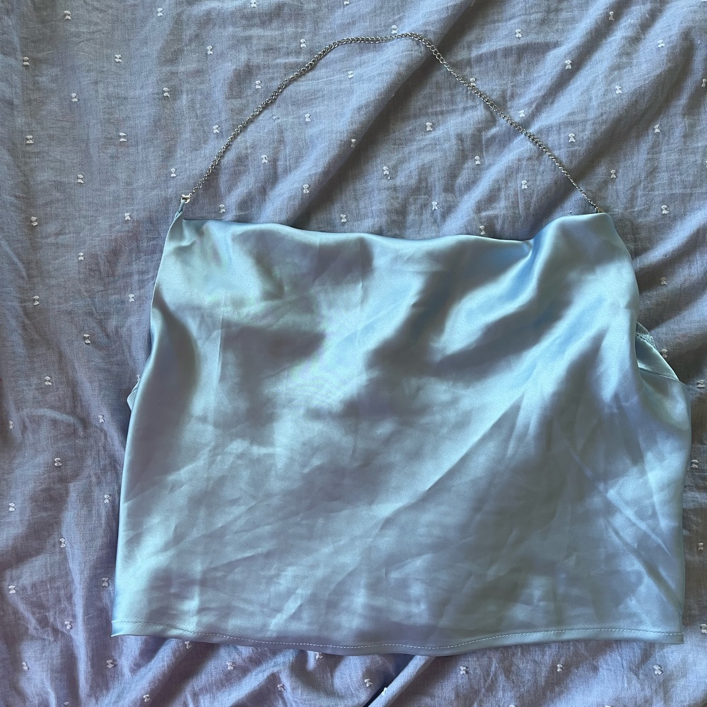 Light blue satin draped blouse with chain strap. Stretchy back and nice material